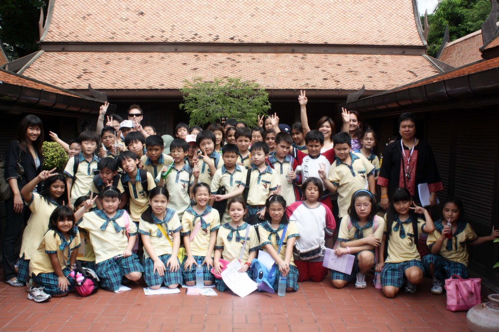 Grade 4 & 5 students with Ms. Jim, Ms. Um, Ms. Au, Ms. Prerna and Mr. Graham in front of the upper level of the Thai house