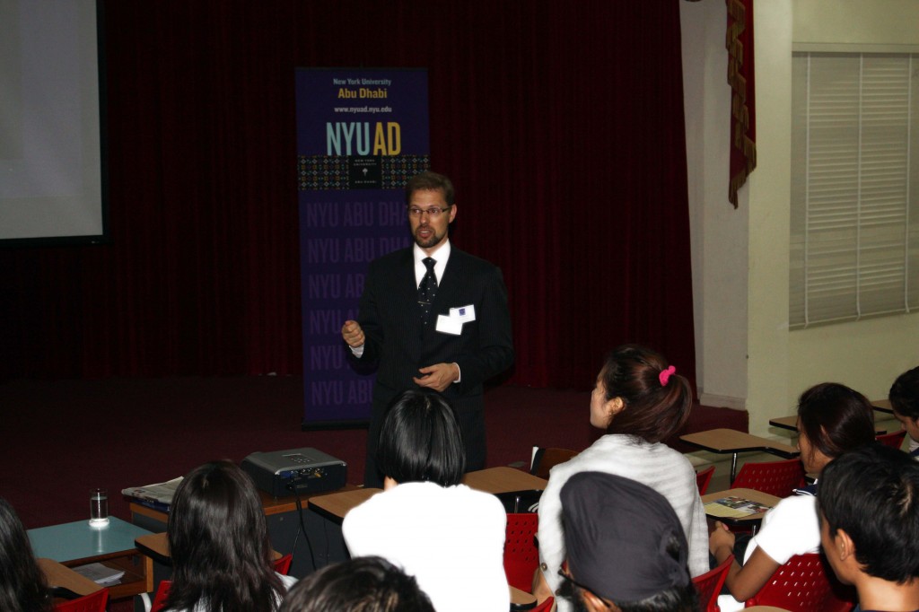 Students listen attentively to the NYU presenter.