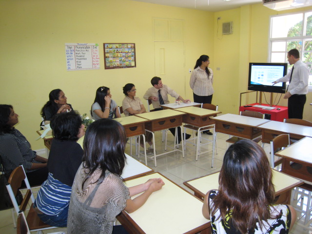 Grade 4 teachers team-conferencing with parents