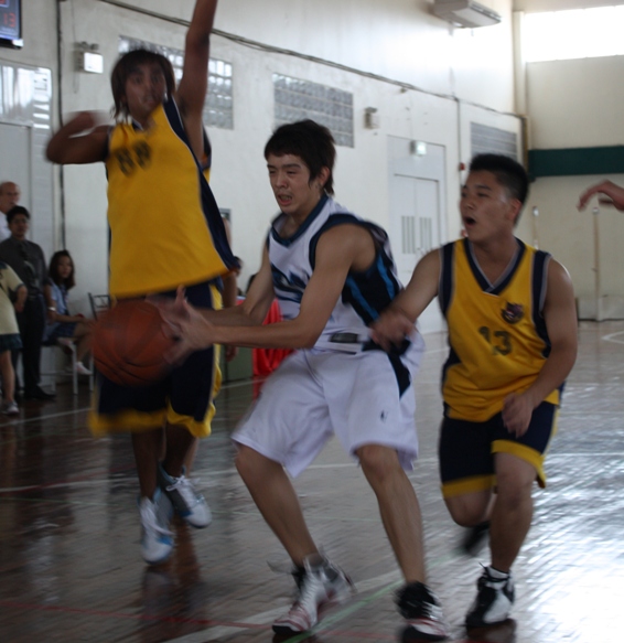 Point guard Boss, grade 10, threads to a couple of St. Andy defenders.