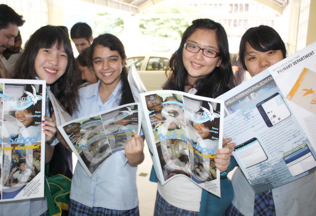 Members of the magazine staff review the results of their hard work