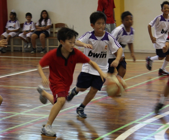 Oscar, grade 4, easily zips past a Rasami defender.