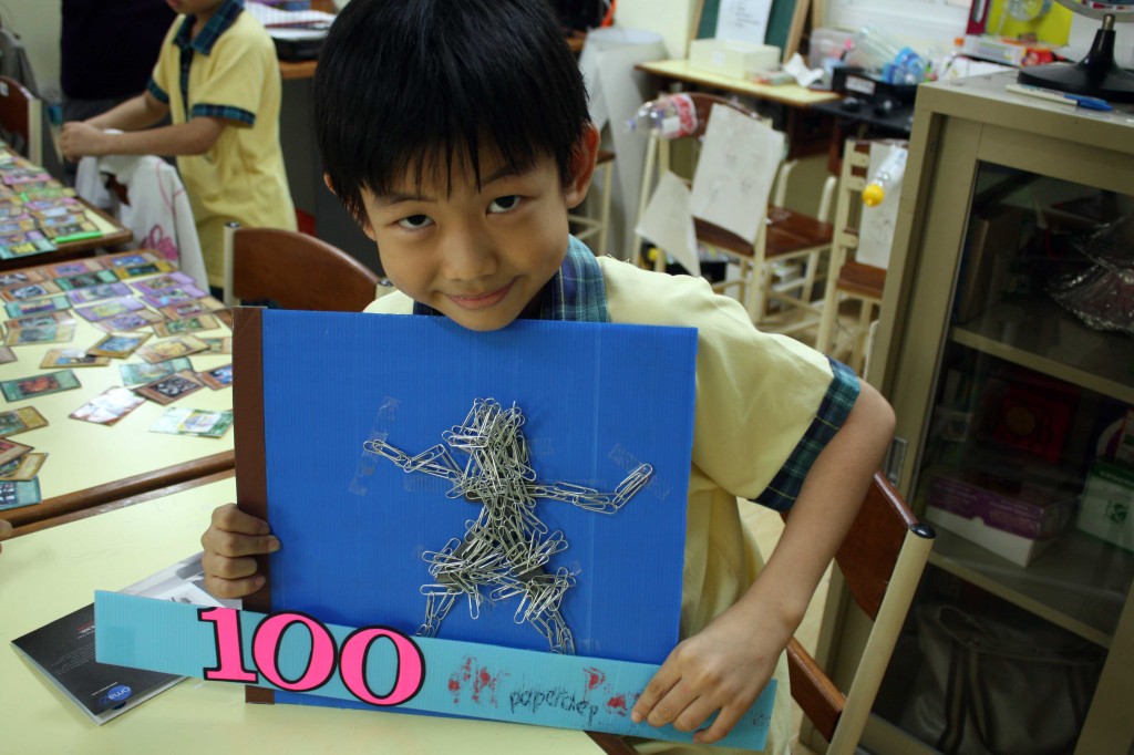 A grade two student showing his 100 Days project