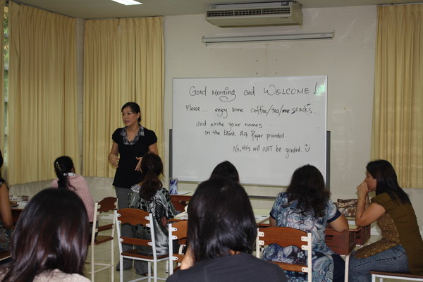 Counselor welcoming parents to the "Morning Coffee Talks" event 